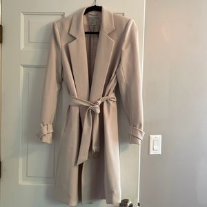 Super stylish cream overcoat with lining.  Never worn